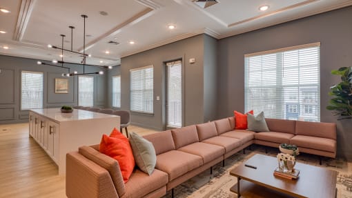 a living room with a couch and a table at The Bella at Westchester, Midlothian, VA