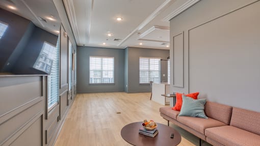 a living room with a couch and a coffee table at The Bella at Westchester, Midlothian