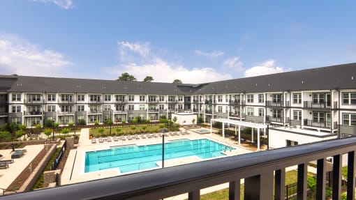 a balcony view of an apartment building and a swimming pool at Ainsworth, Richmond