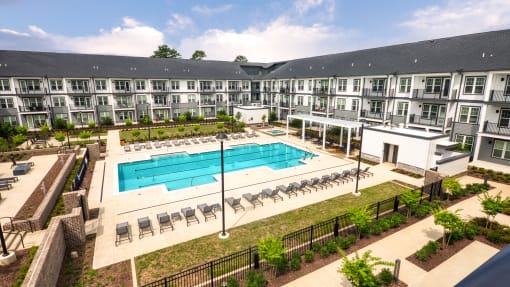 an aerial view of an apartment building with a swimming pool at Ainsworth, Richmond, Virginia