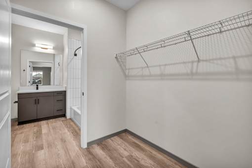 A bathroom with a sink and a mirror.