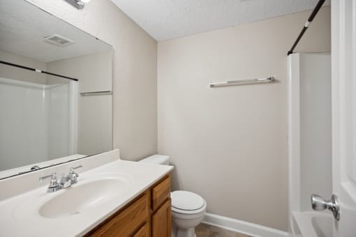 the preserve at ballantyne commons apartment bathroom with sink toilet and shower
