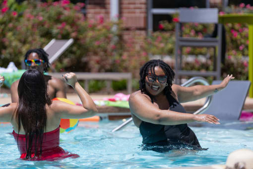 a group of women in a pool playing in the water at Proximity at ODU in Norfolk, VA