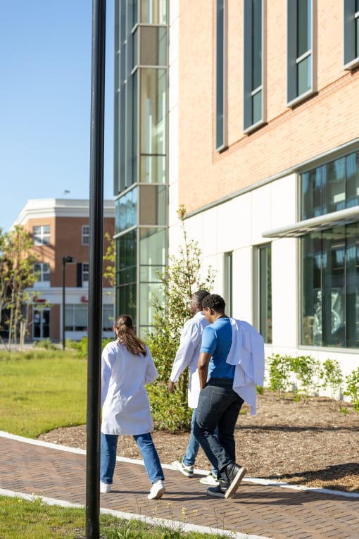 a group of people walking outside of a building at Proximity at ODU in Virginia 23508