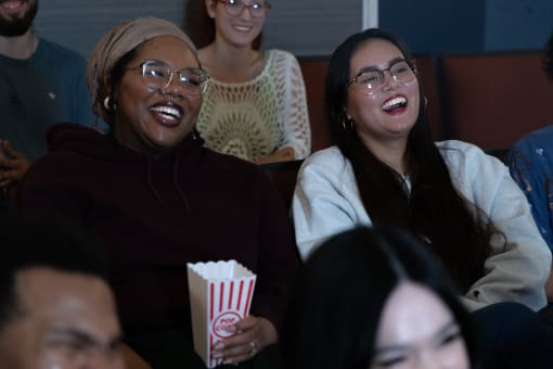two women laughing in the cinema at Proximity at ODU in Norfolk, VA 23508