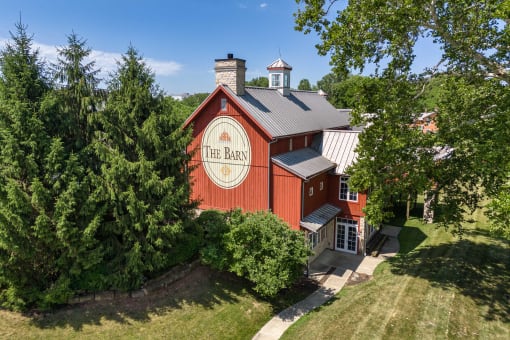 a red barn with the bar on the side of it