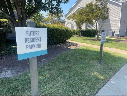 a future resident parking sign in front of a house