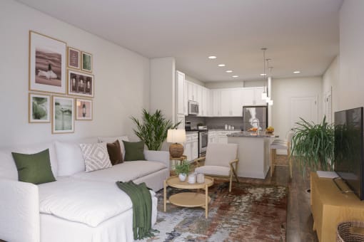 a living room with a white couch and two chairs at The Bella at Westchester, Virginia, 23113