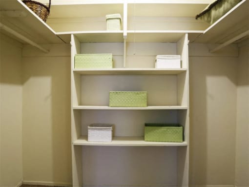 a shelf in a closet with boxes on it at Gates of West Bay, Norfolk, 23503