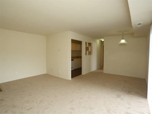 an empty living room and a kitchen in a house at Gates of West Bay, Norfolk, VA 23503
