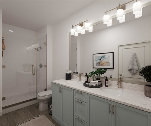 a bathroom with a sink and a shower and a toilet at The Port at East Beach Apartments and Marina, Virginia