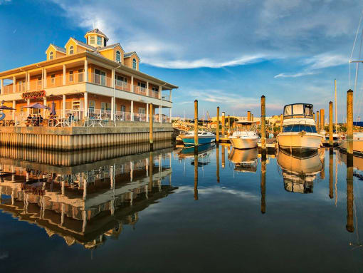 Longboards restaurant and boats docked at marina at The Port at East Beach Apartments and Marina, Virginia
