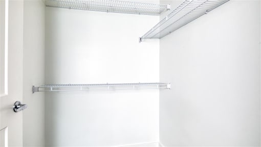 an empty closet with a white wall and a white door at The Port at East Beach Apartments and Marina, Norkfolk, 23518