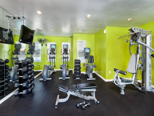 a gym with weights and cardio equipment at Addison Crater Woods, Petersburg