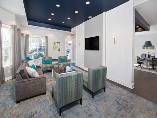 a living room filled with furniture and a flat screen tv at Addison Crater Woods, Petersburg, VA