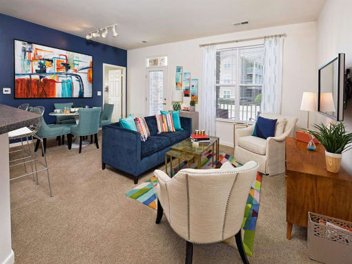 a living room with blue walls and white furniture at Addison Crater Woods, Virginia
