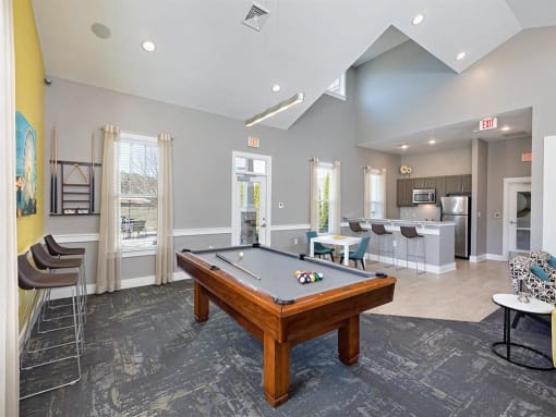 a game room with a pool table and a bar at Addison Crater Woods, Petersburg Virginia