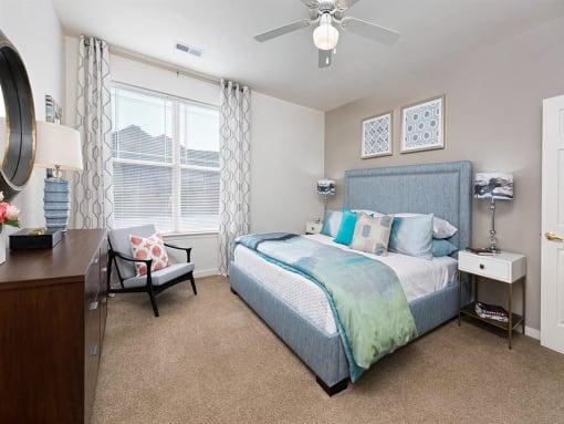 a bedroom with a bed and a ceiling fan at Addison Crater Woods, Virginia