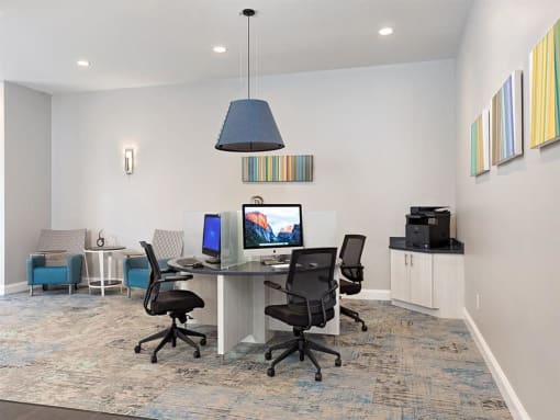 a room with a desk with two computers on it at Addison Crater Woods, Petersburg, 23805