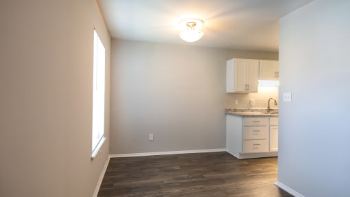 a kitchen and dining area in a 555 waverly unit