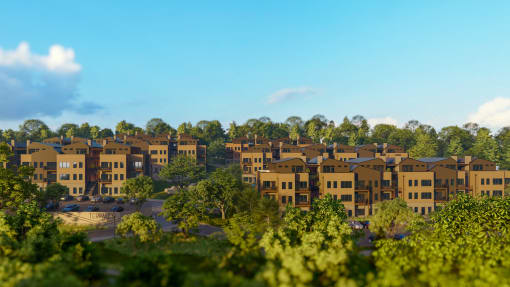 an aerial view of an apartment complex surrounded by trees at Terraces at High Mountain, Huntsville Alabama
