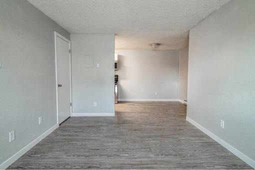 A room with a grey floor and white walls.