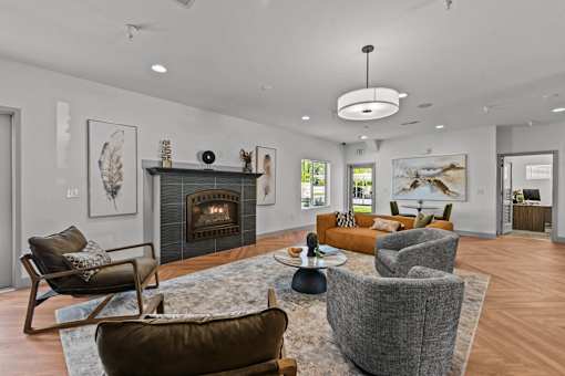 A modern living room with a fireplace and comfortable seating.