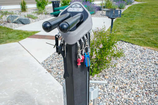 A bike rack with a bike locked to it.