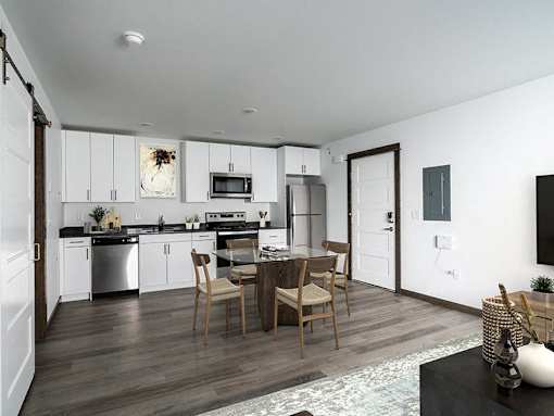 A modern kitchen with a dining table and chairs.