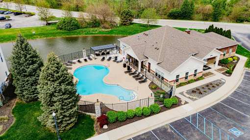 A large house with a pool in the backyard.