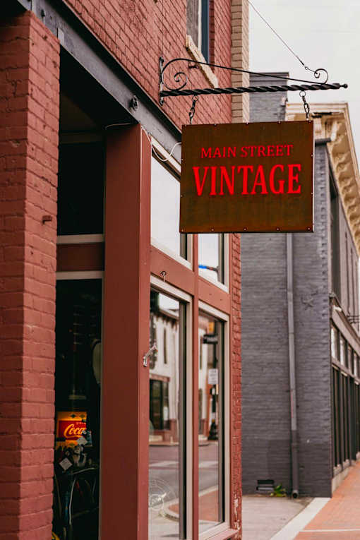 A red brick building with a sign that says Main Street Vintage.