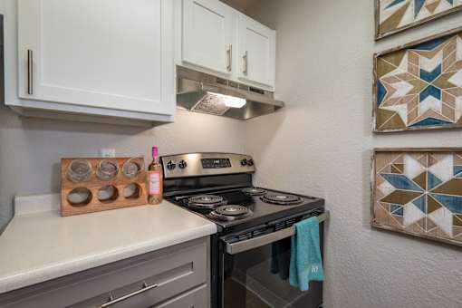 Kitchen with Stove at Peaks at Sandia View, Albuquerque, NM