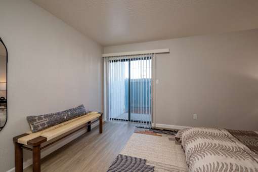 Room with bench and Sliding Glass Door at Peaks at Sandia View, New Mexico, 87102