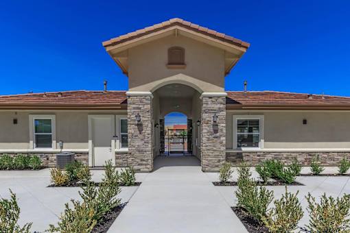 the entrance to a building with a walkway and columns at Edgewater, Pittsburg, 94565  