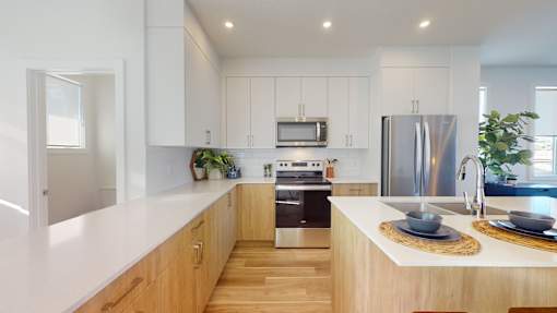 A modern kitchen with wooden cabinets and stainless steel appliances.