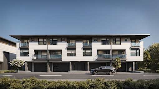A modern building with a car parked in front.