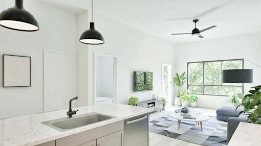 A modern kitchen with a white countertop and a grey rug.