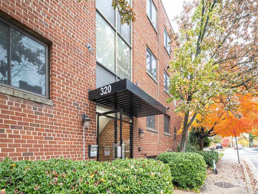 A brick building with the number 320 on it.