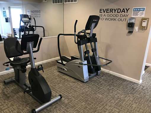 A gym room with a wall that says "Everyday is a good day to work out".