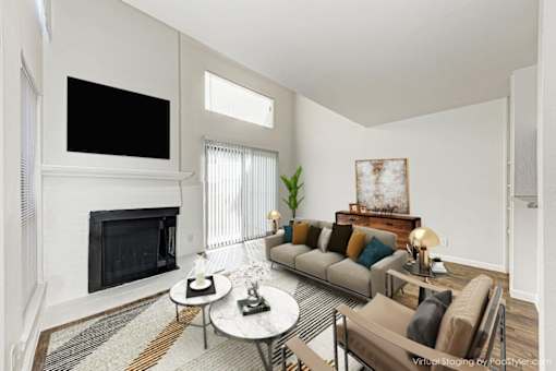 A living room with a fireplace and a couch.