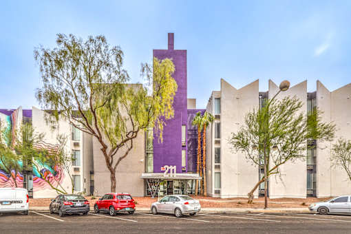 A purple building with a cross on it.