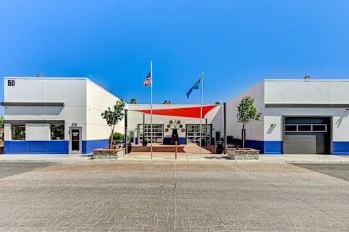 A building with a flag on top and a number 50 on the left side.