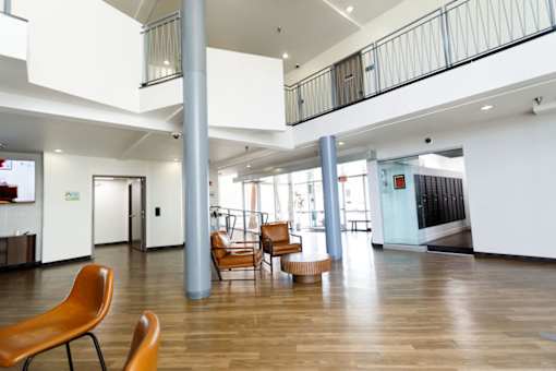 A large open space with a long hallway and a balcony.