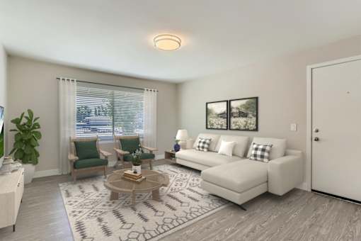 A living room with a couch, chairs, and a coffee table.