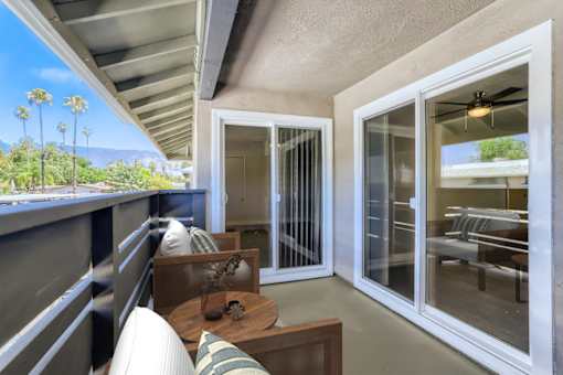 A patio with a table and chairs is shown.
