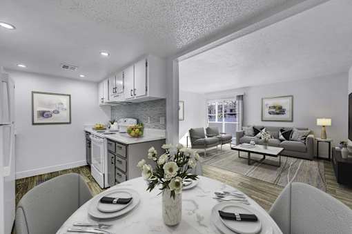 A modern dining room with a table set for two.
