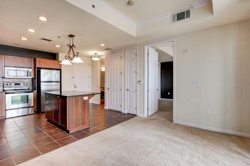 A kitchen with a refrigerator, oven, and microwave.