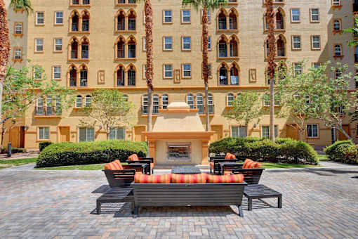 A large building with a courtyard in front of it.