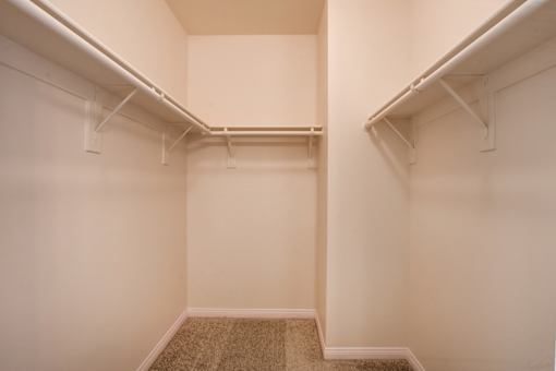 A room with white walls and a carpeted floor.