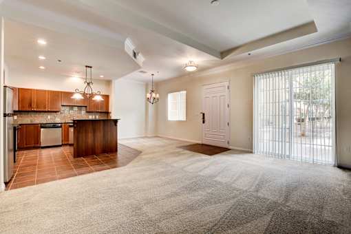 A spacious kitchen with wooden cabinets and a large island.